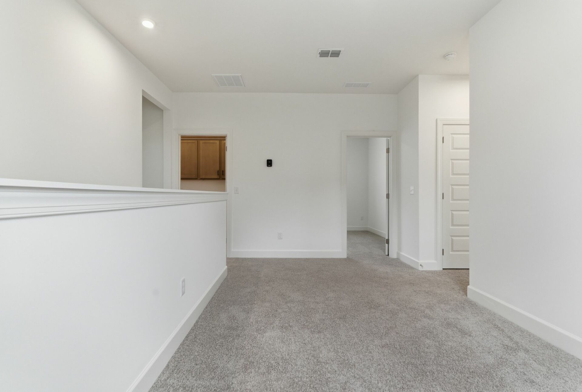 loft with light carpet