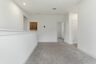 loft with light carpet