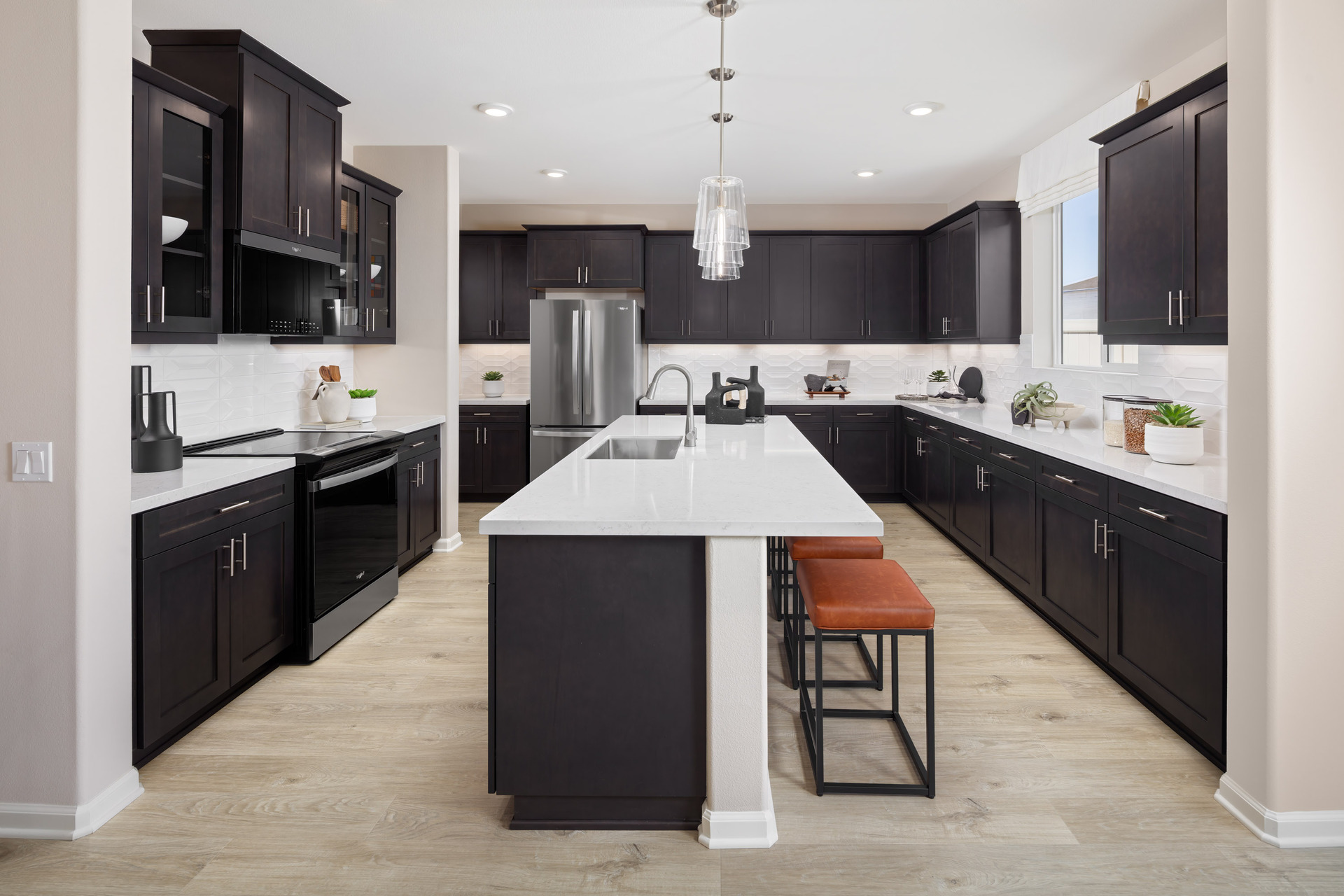 kitchen with white countertops and dark cabinets