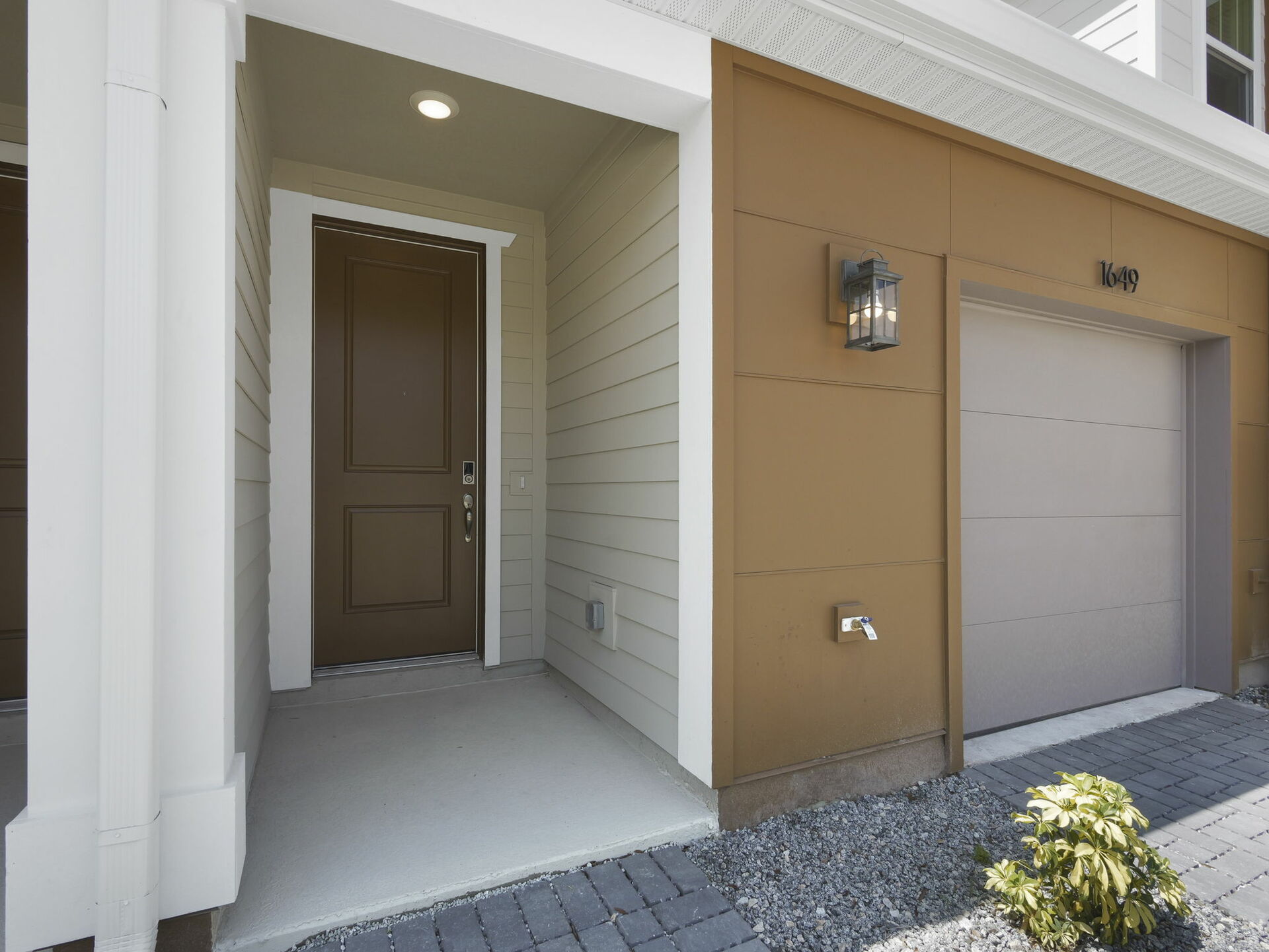 front exterior of the home with view of garage