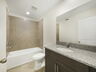 single sink vanity with shower and water closet