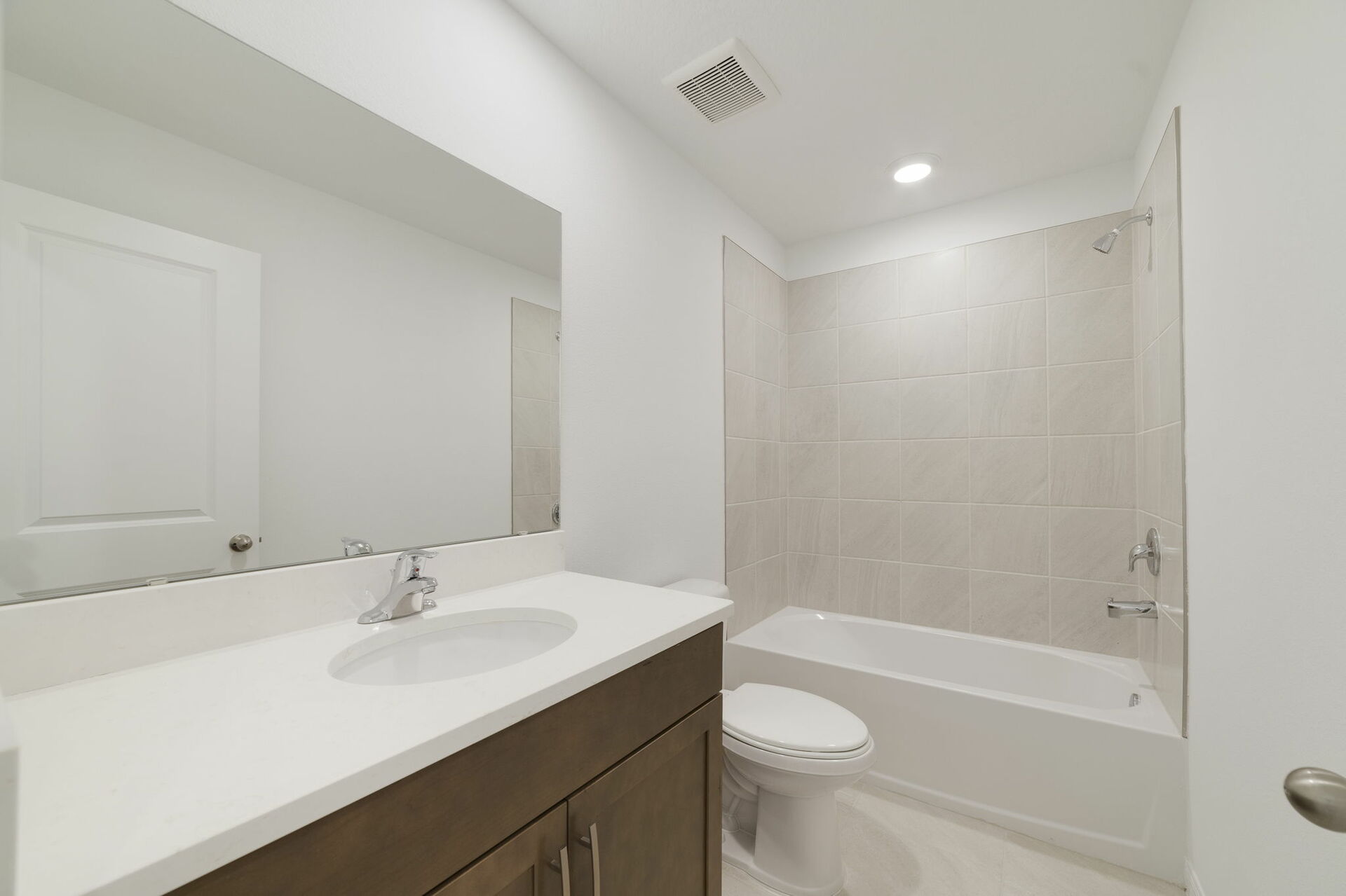 single sink vanity, water closet and shower