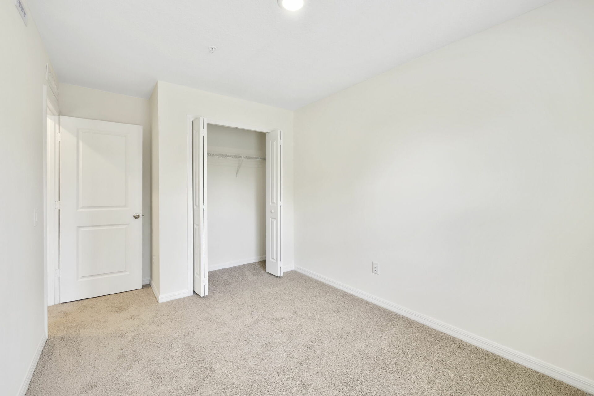 carpet throughout with a closet and a single window
