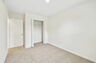 carpet throughout with a closet and a single window