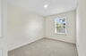 carpet throughout with a closet and a single window
