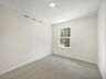 carpet throughout with single window and closet
