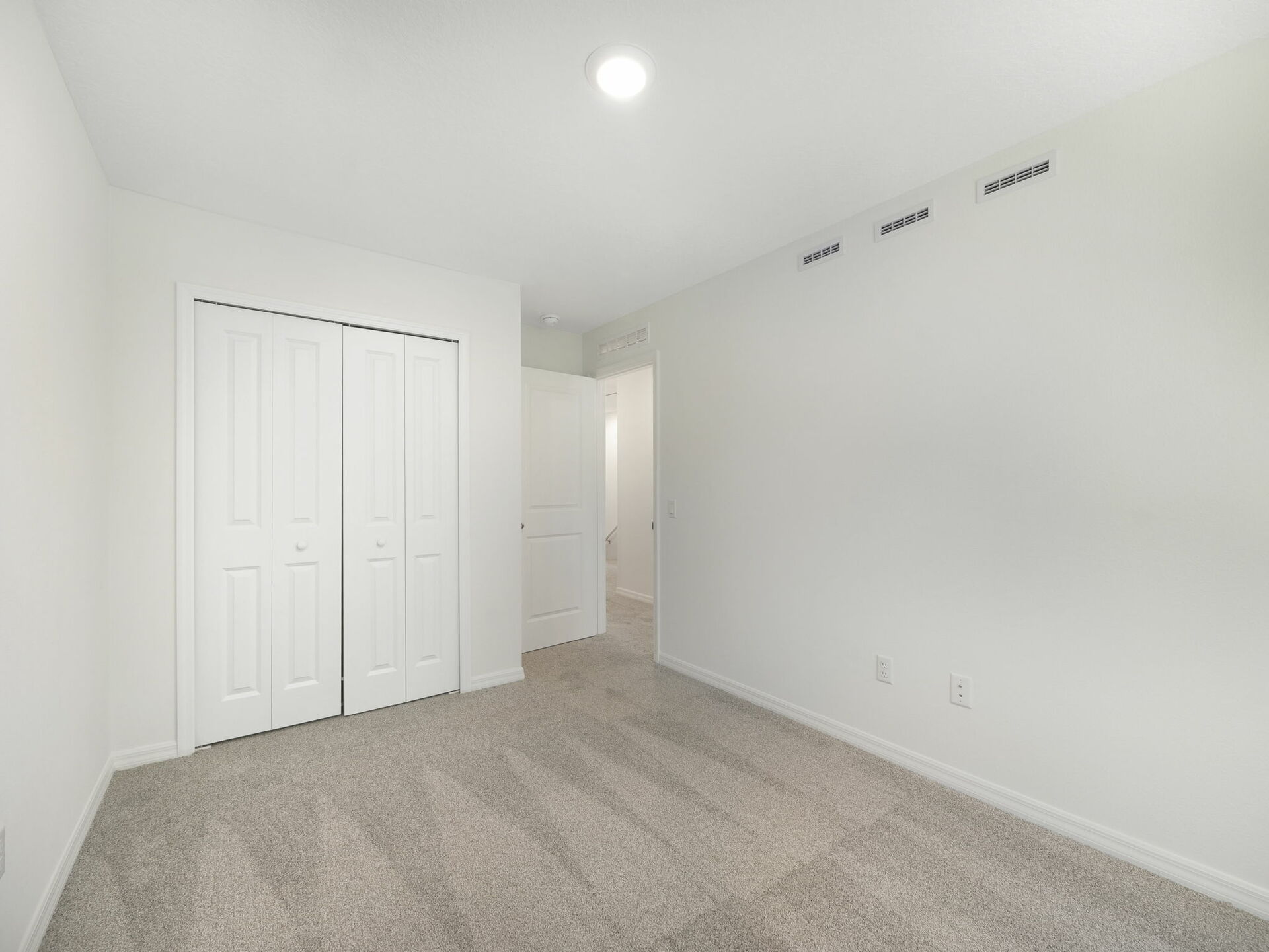 carpet throughout with single window and closet