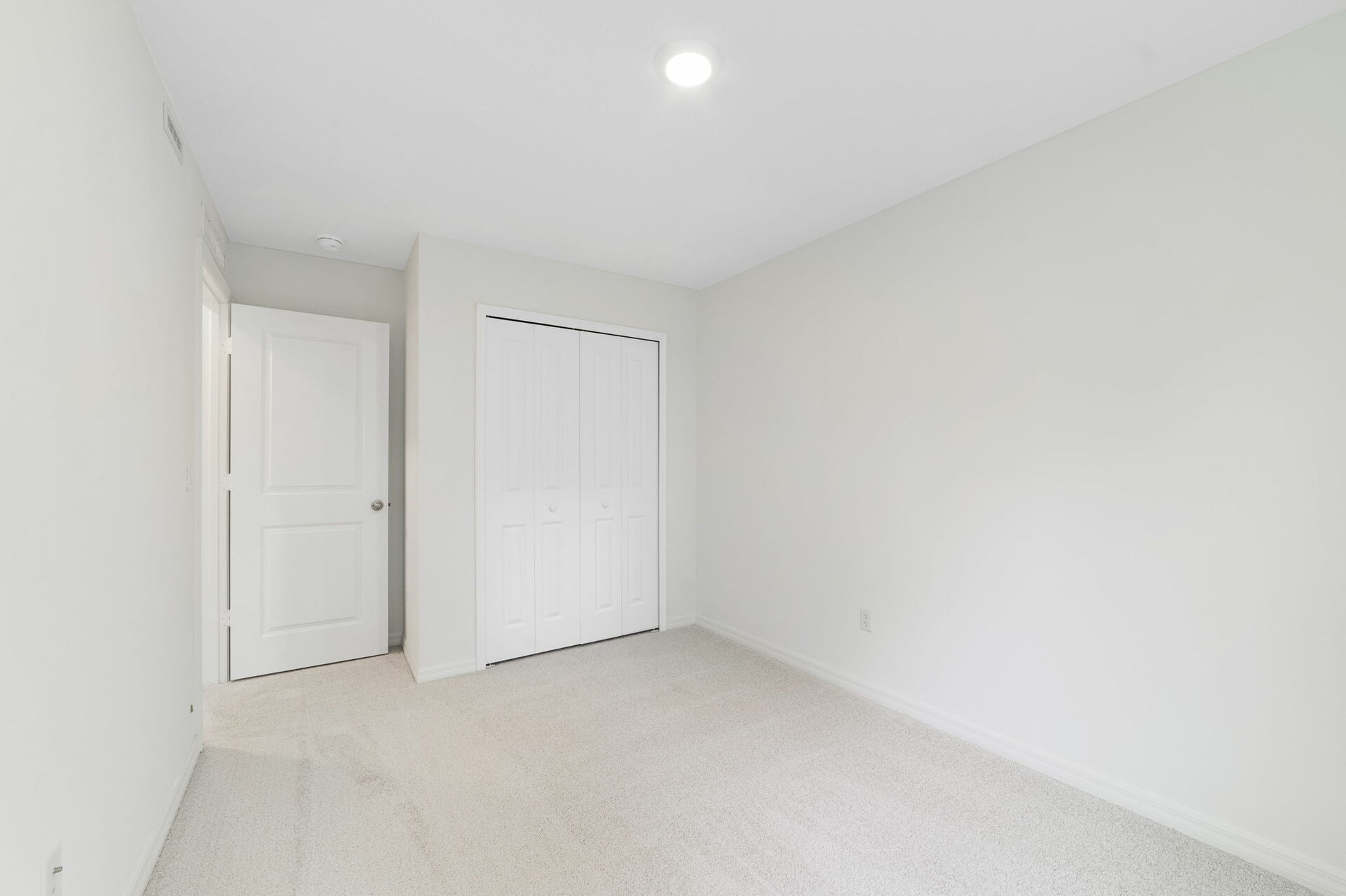 carpet throughout with single window and closet