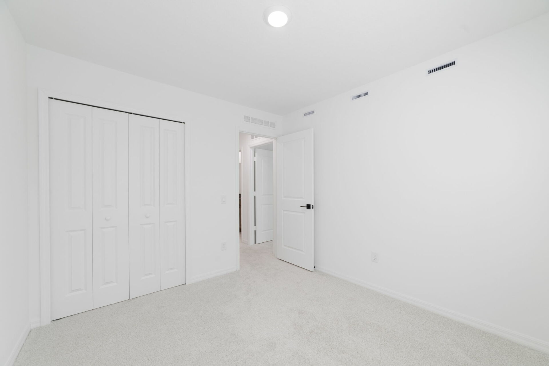 bedroom with carpet throughout and access to the closet 