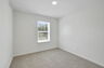 carpet throughout with a closet and single window