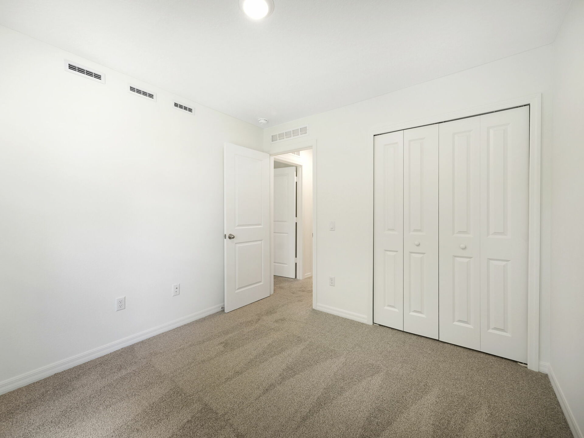 carpet throughout with single window and closet