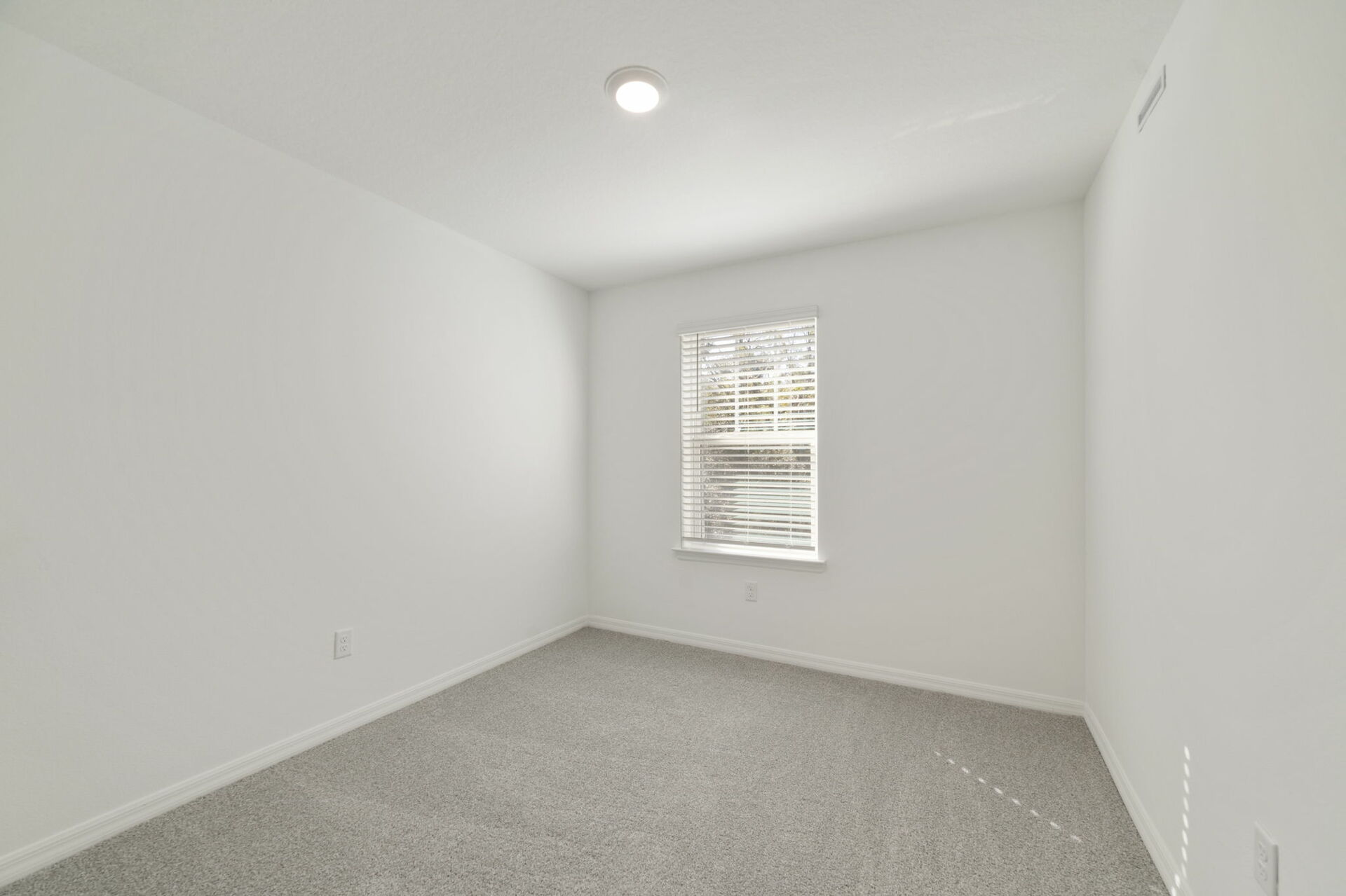 room with carpet throughout and access to the closet