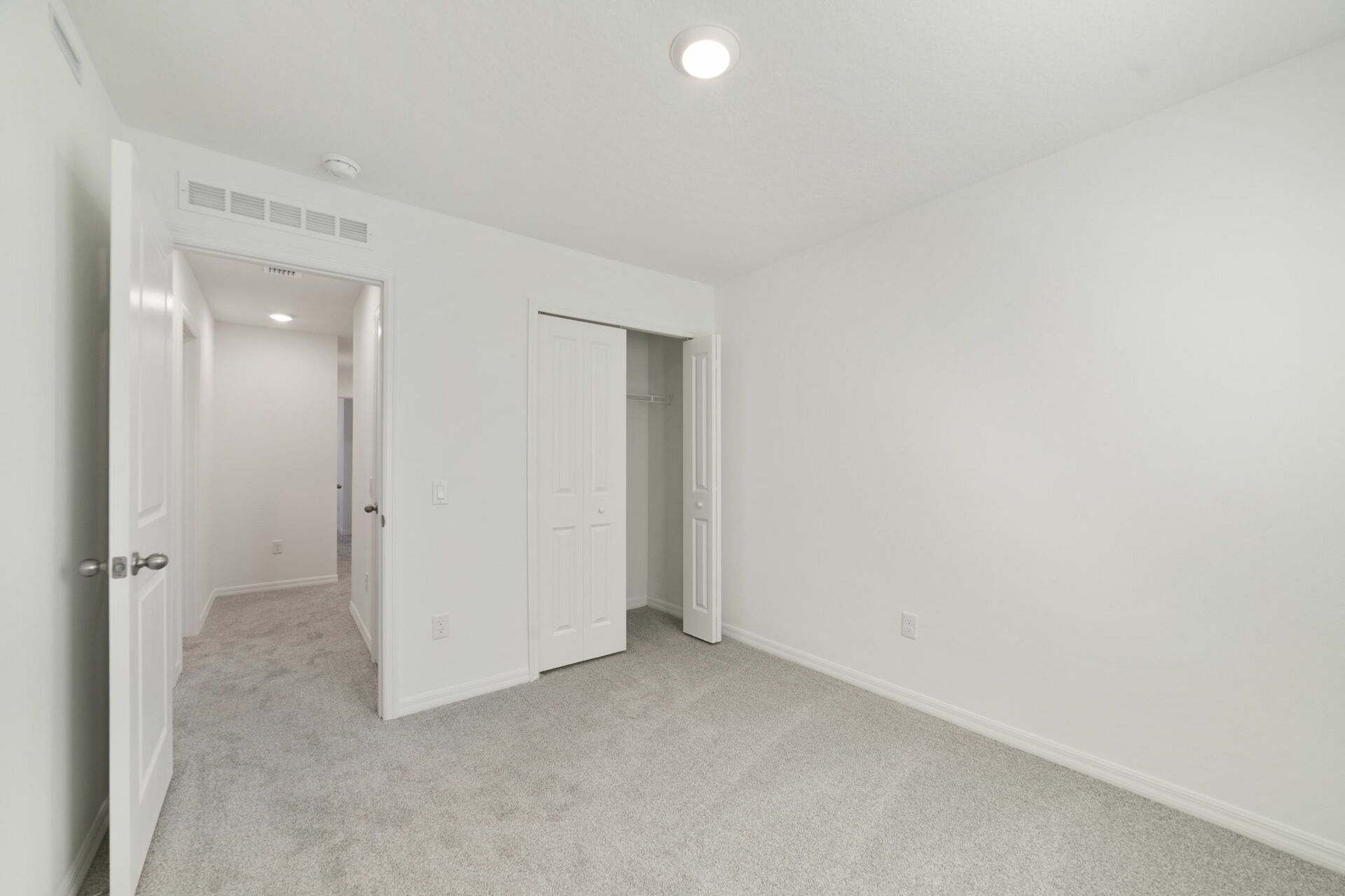 room with carpet throughout and access to the closet