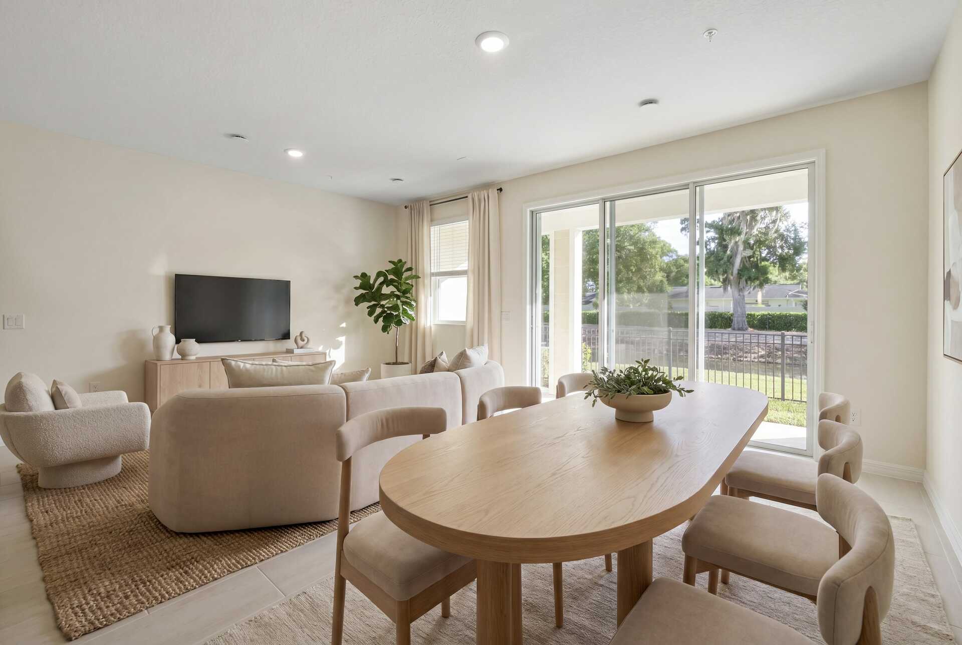 room with access to the lanai and view of the kitchen