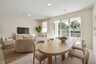 room with access to the lanai and view of the kitchen