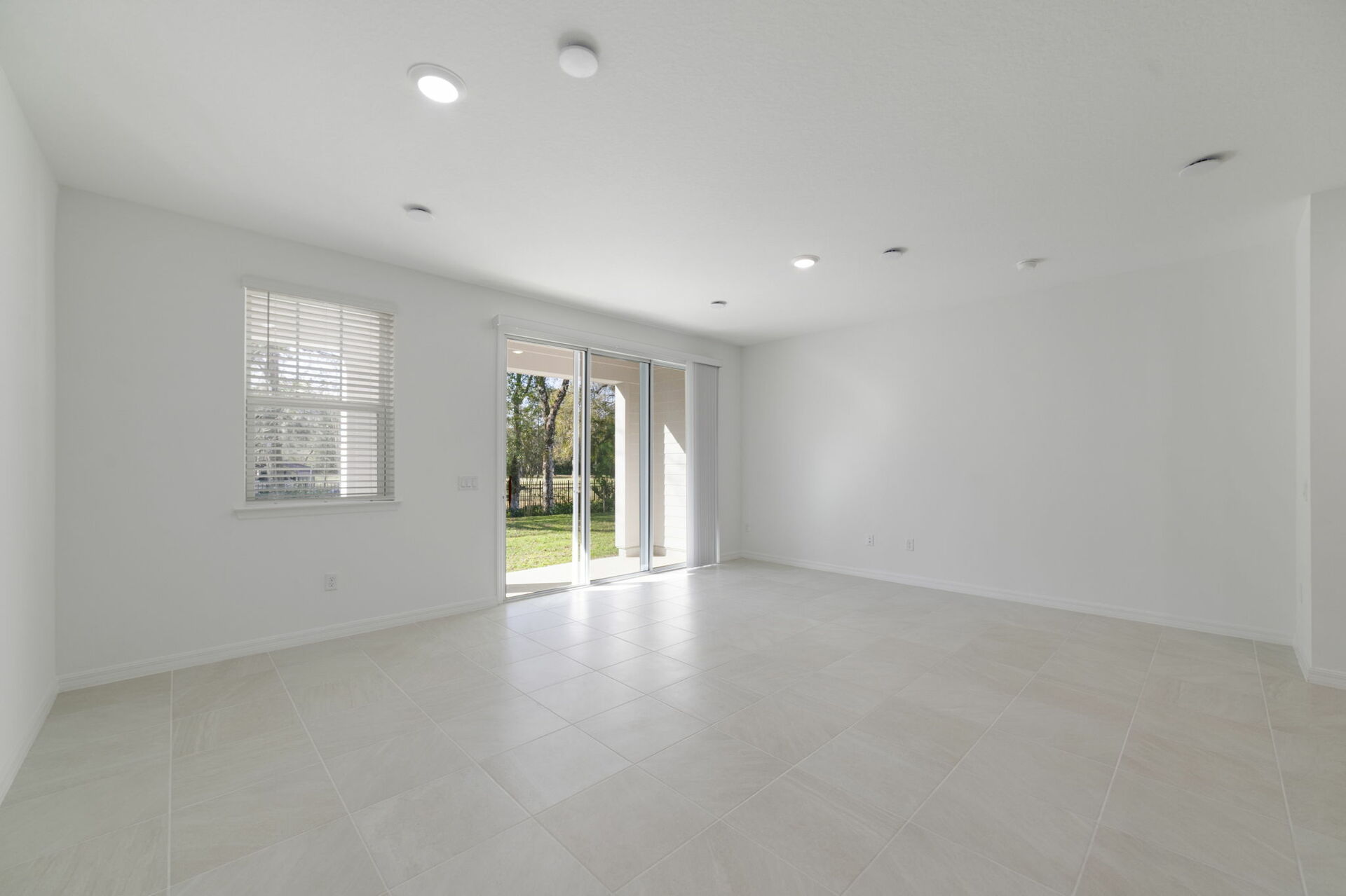 room with access of covered lanai and access to the kitchen