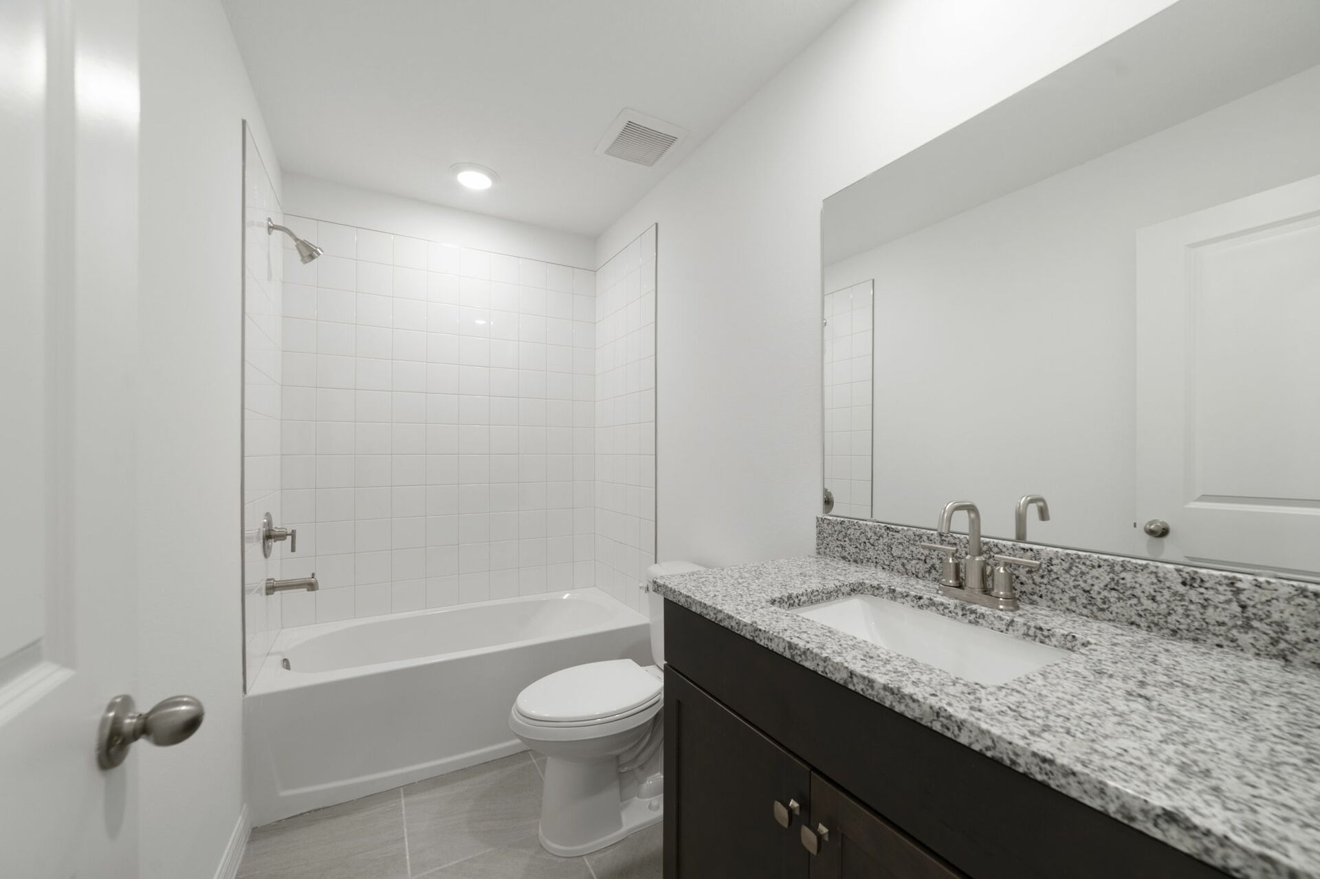 single sink vanity, water closet, shower