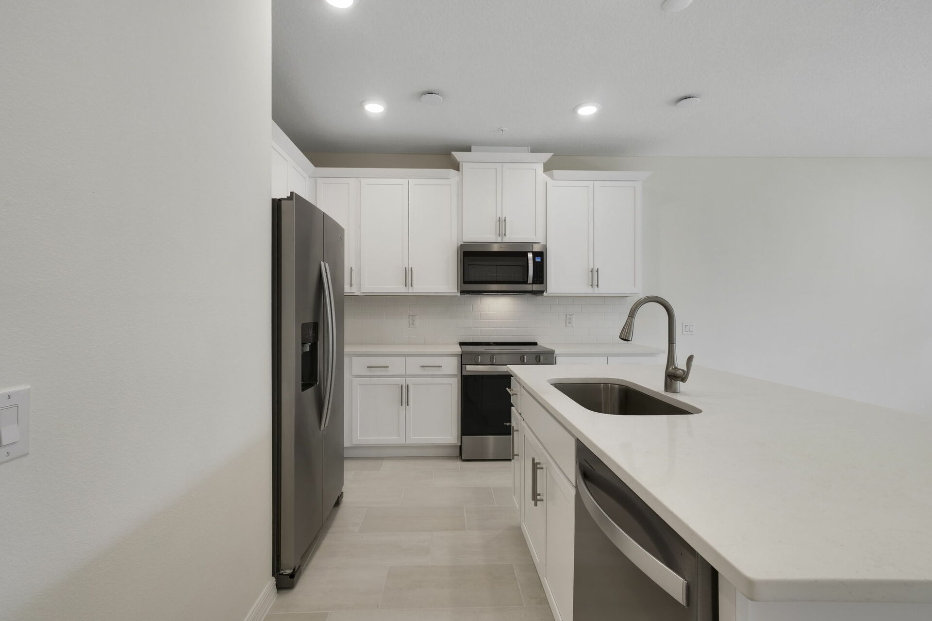 center island with stainless steel appliances