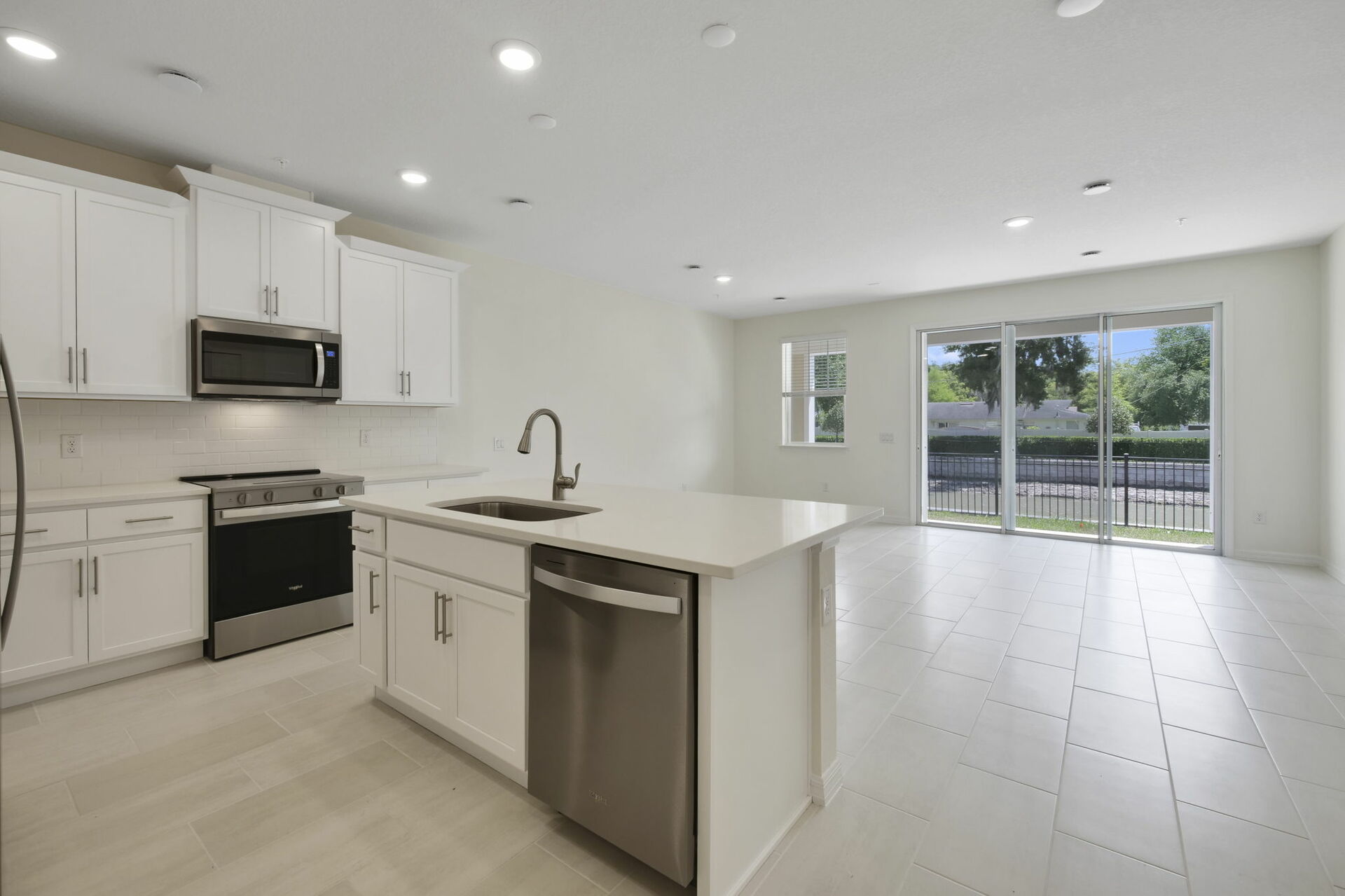 center island with stainless steel appliances