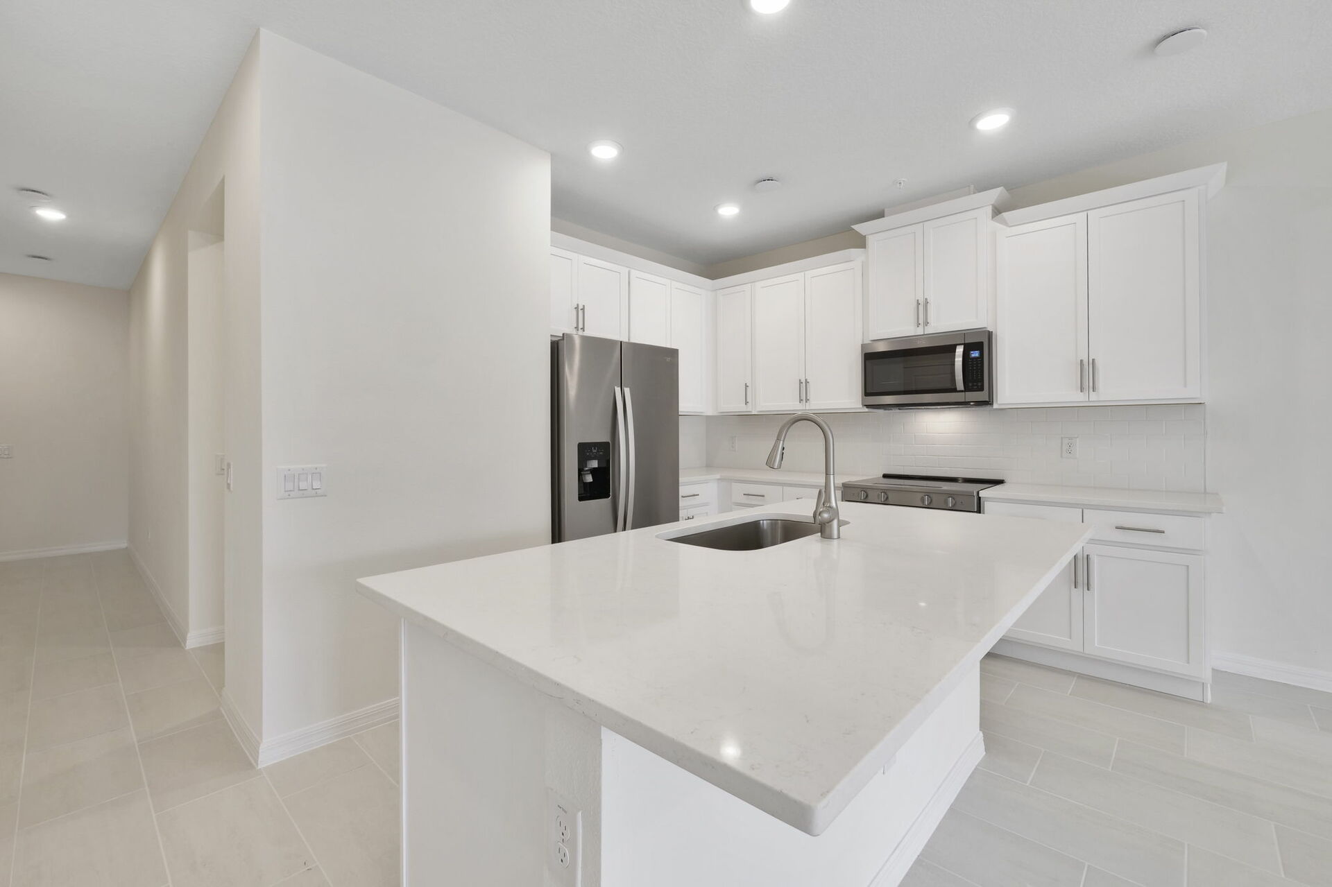 center island with stainless steel appliances