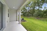 covered patio and backyard