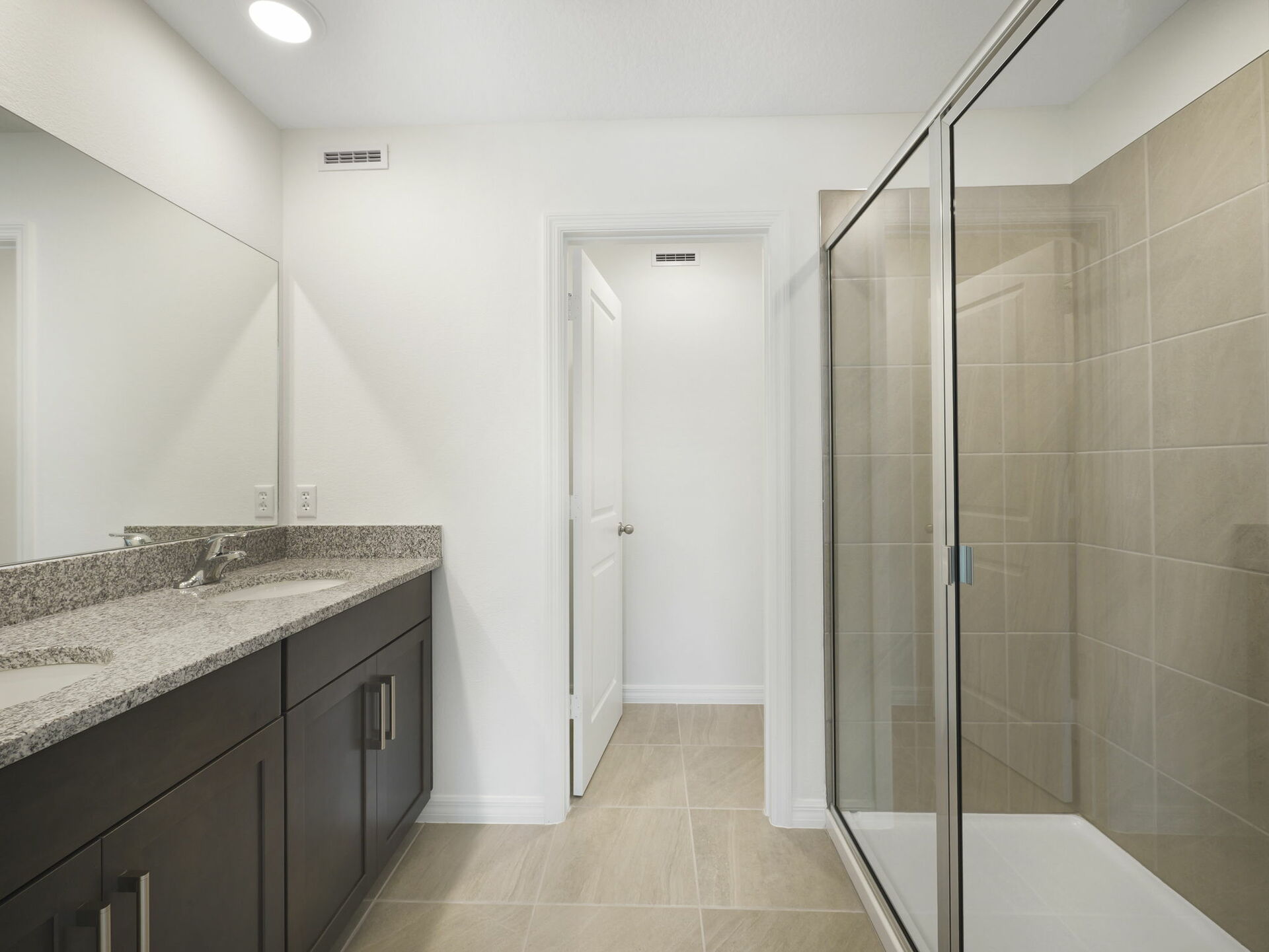 dual sink vanity, with shower and water closet