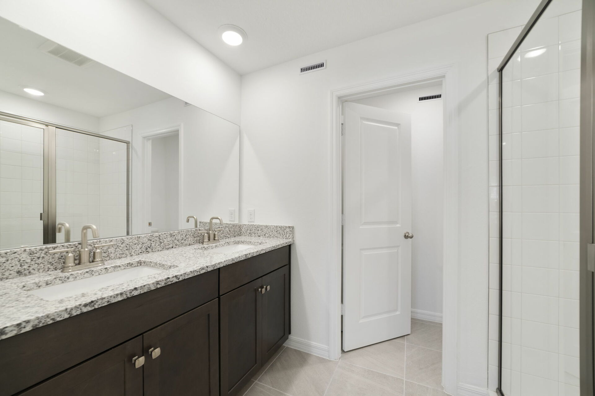 dual sink vanity with mirror and shower