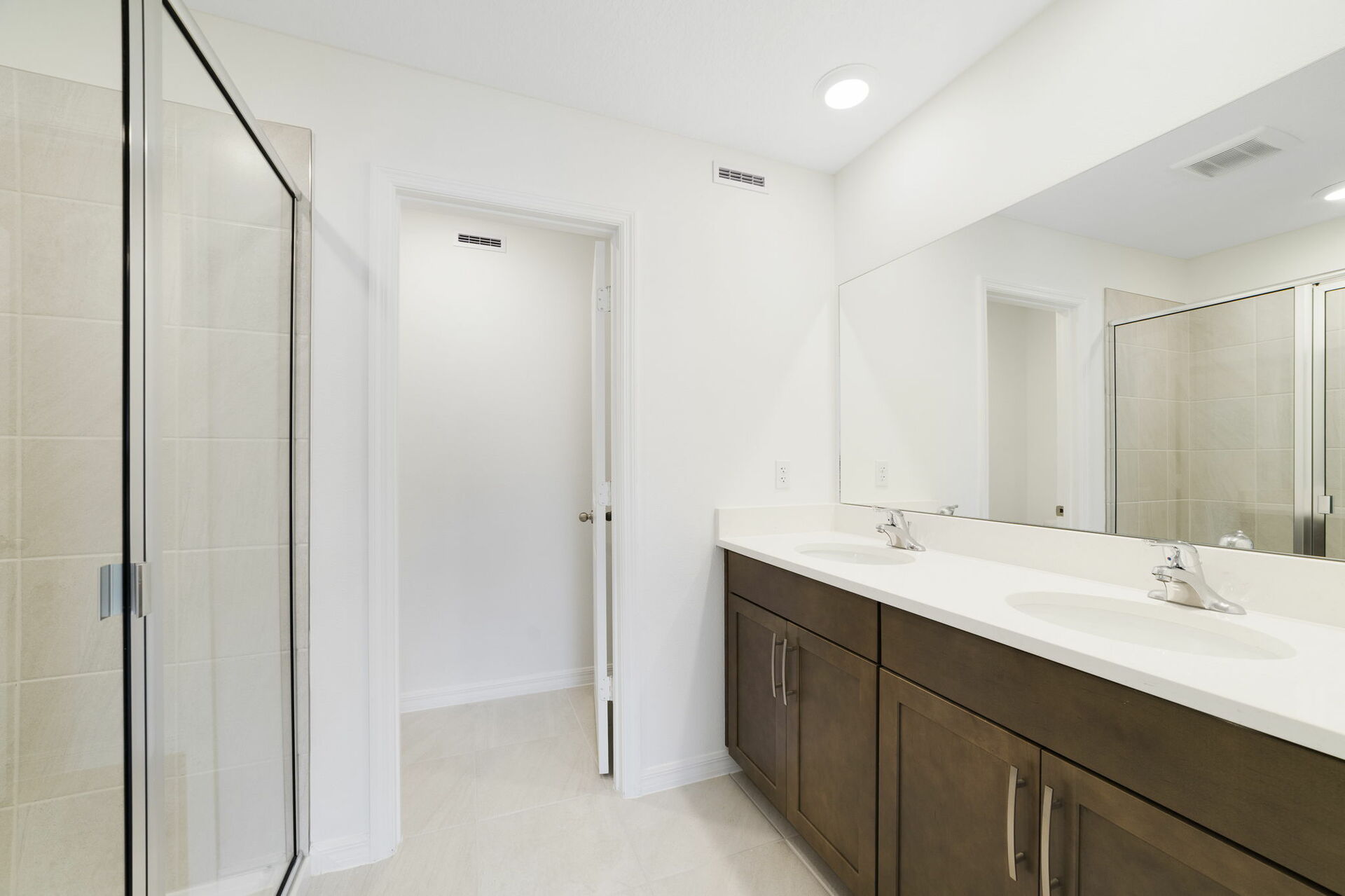 dual sink vanity and shower
