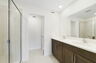 dual sink vanity and shower