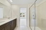 dual sink vanity and shower