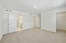 carpet throughout with a walk-in closet and 2 large windows