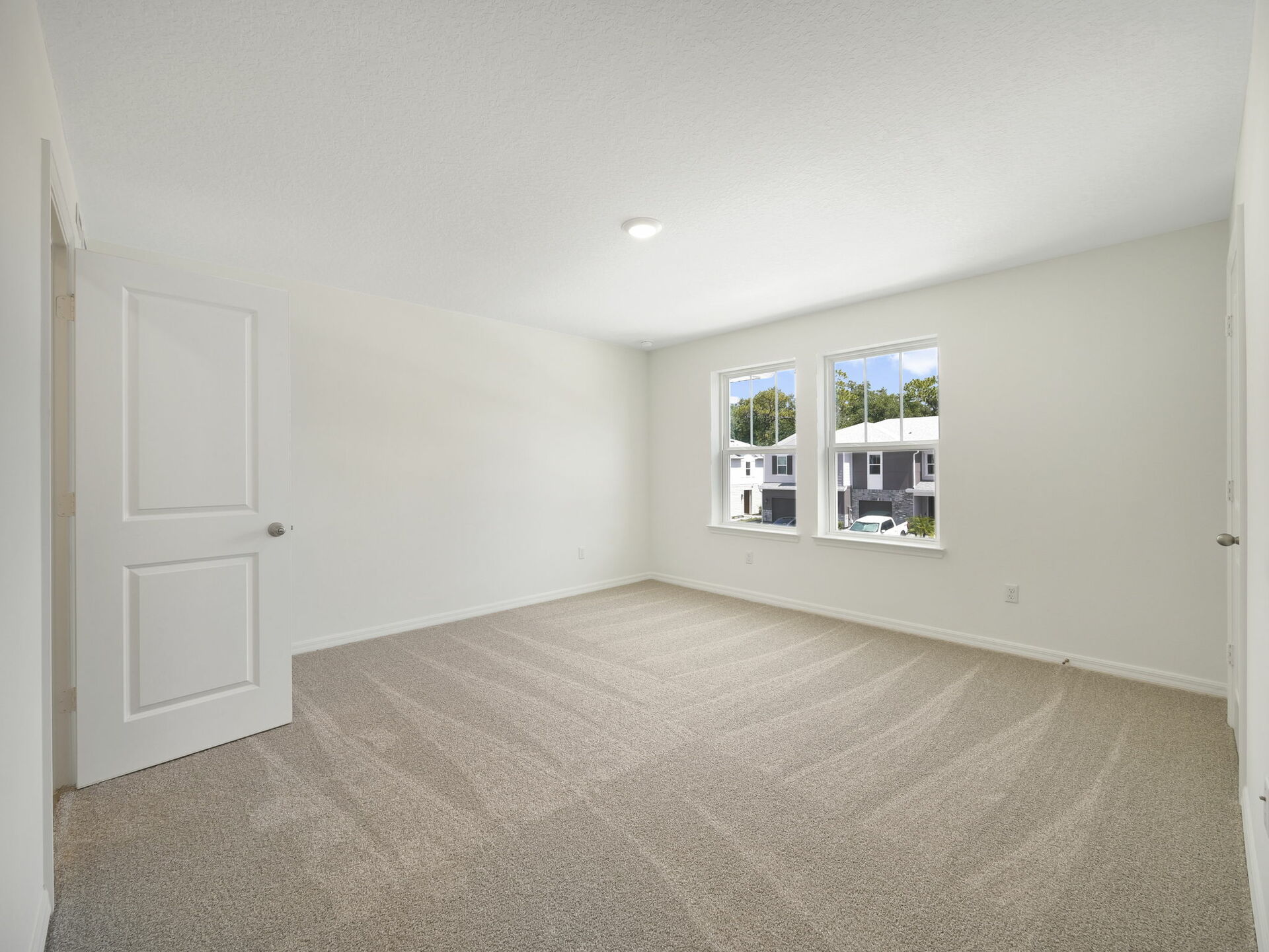 carpet throughout with dual windows and access to the primary bathroom