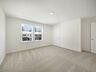 carpet throughout with dual windows and access to the primary bathroom