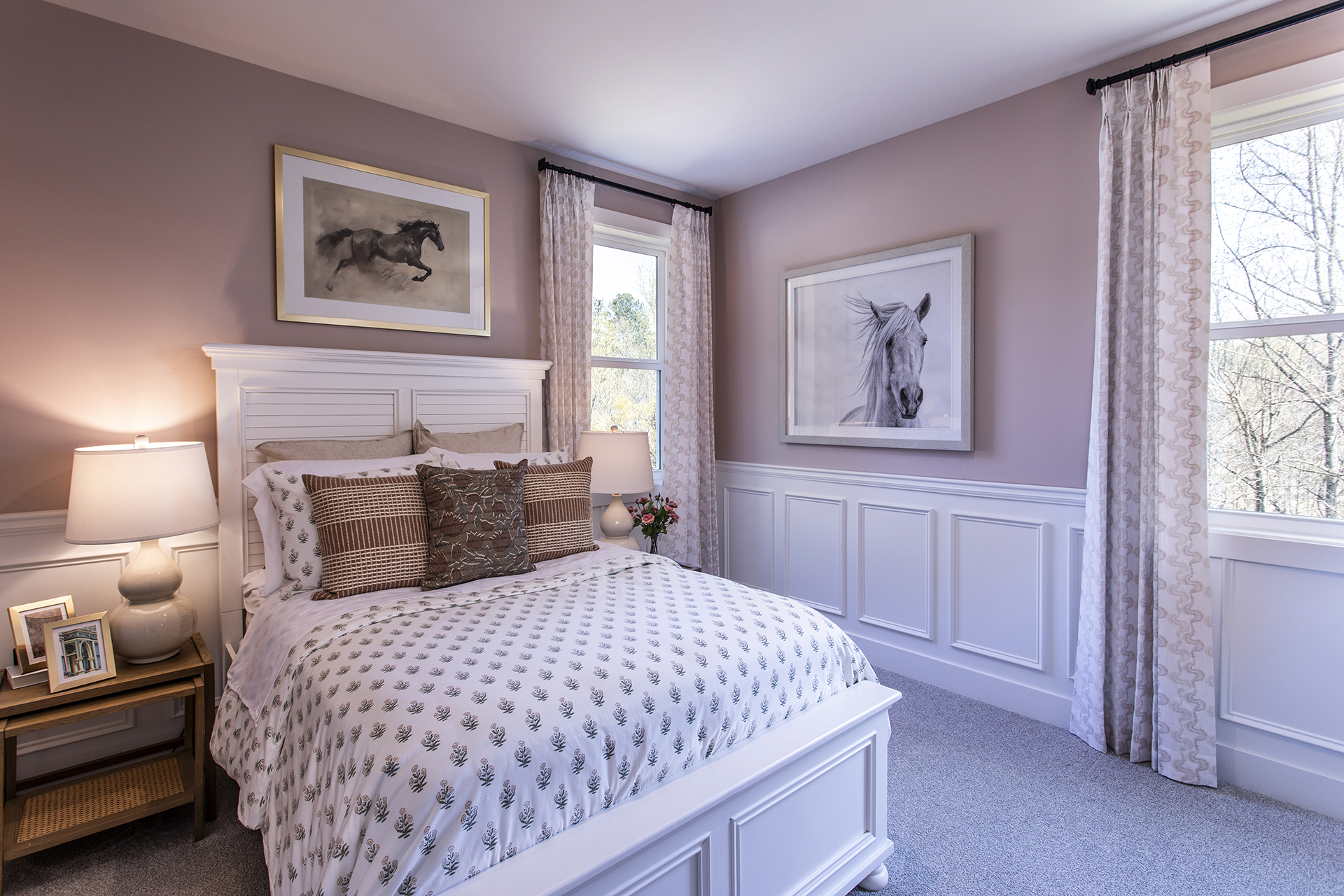 secondary bedroom with carpet and windows