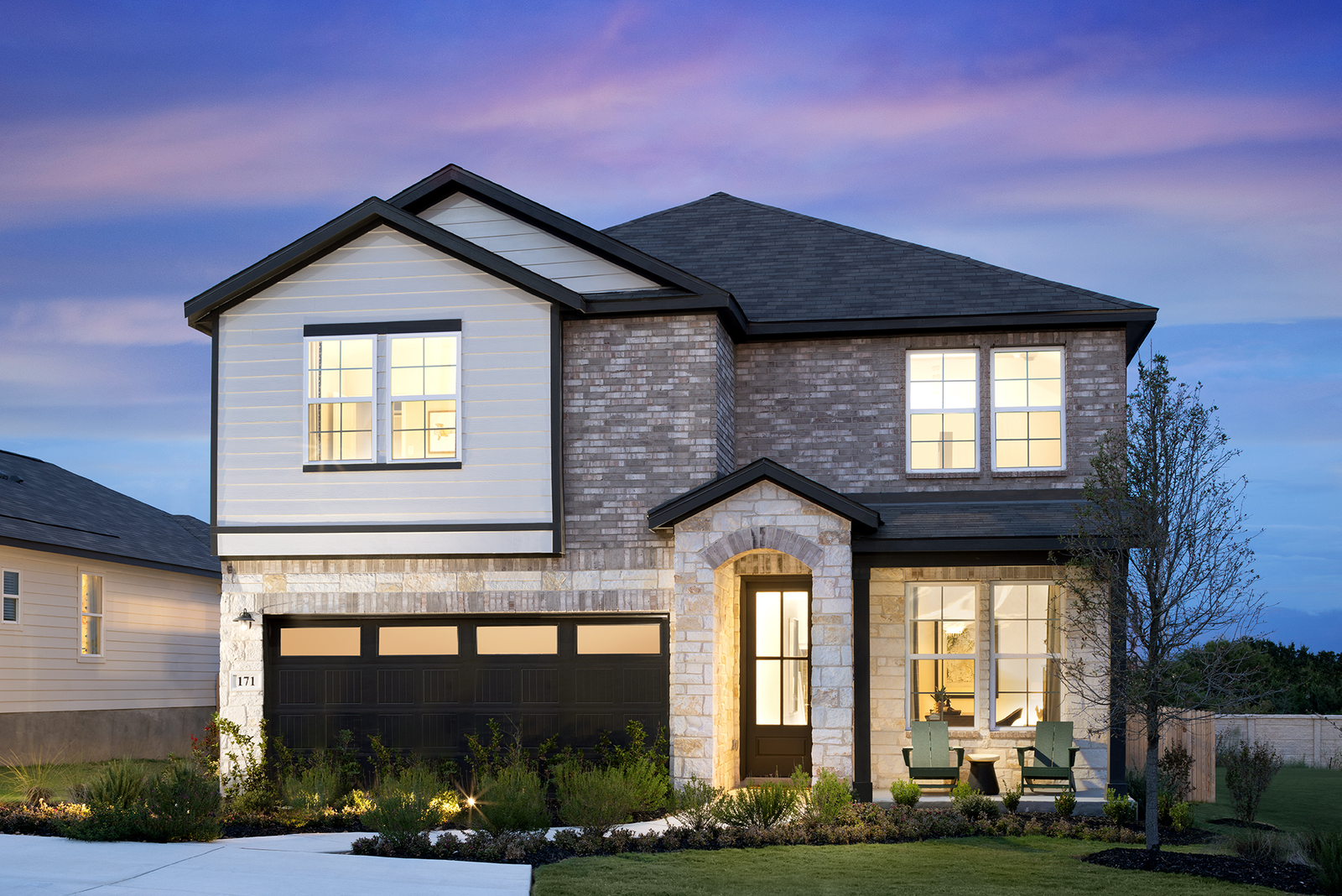 2-story home exterior with brick & stone 