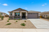 single-story single-family home with desert landscaping and concrete driveway