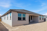 spacious backyard and a covered patio with recessed lighting, ready for relaxation