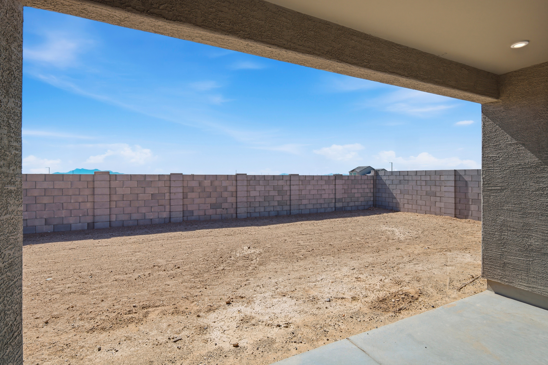 covered patio with recessed lights and views of the spacious backyard
