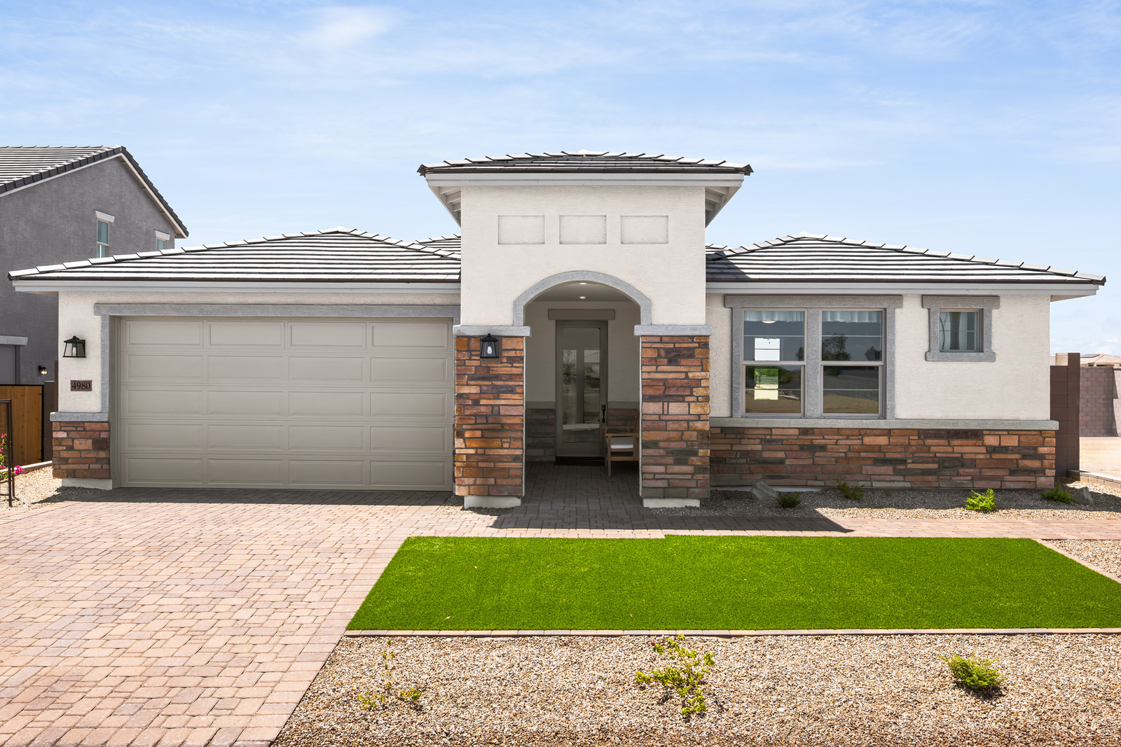 single-story home with desert landscaping