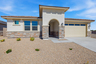 single-story, single-family home with desert landscaping and concrete driveway