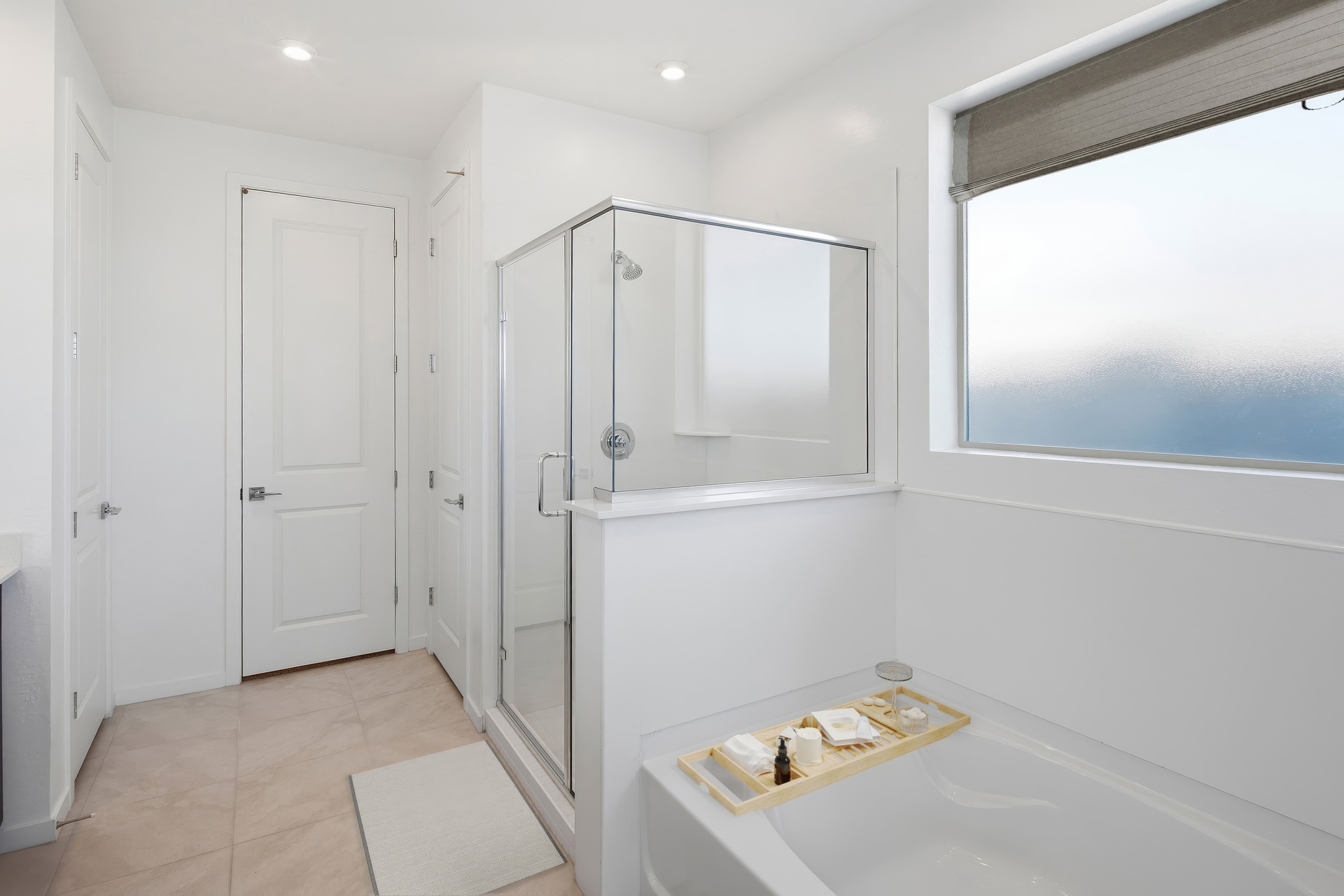 spacious bathroom with a walk-in shower and a soaking tub