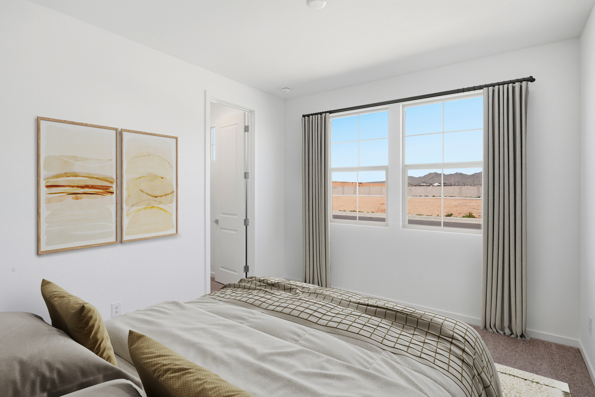 bedroom with a white rug, a large bed, and abstract art on the wall