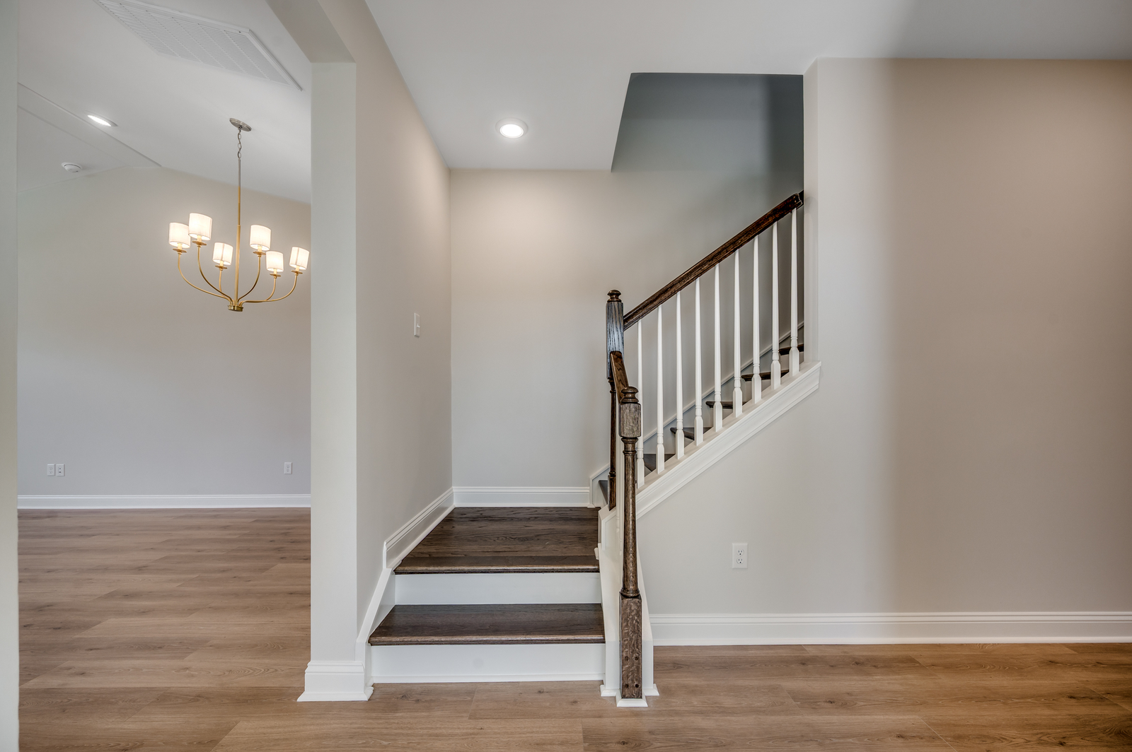 beautifully designed dark brown stairs leading to second story