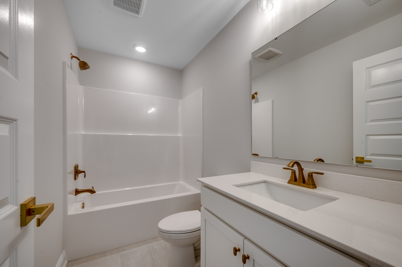 bright white bathroom on second floor with spacious shower and single sink vanity