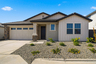 single-story single-family home with desert landscaping and concrete driveway