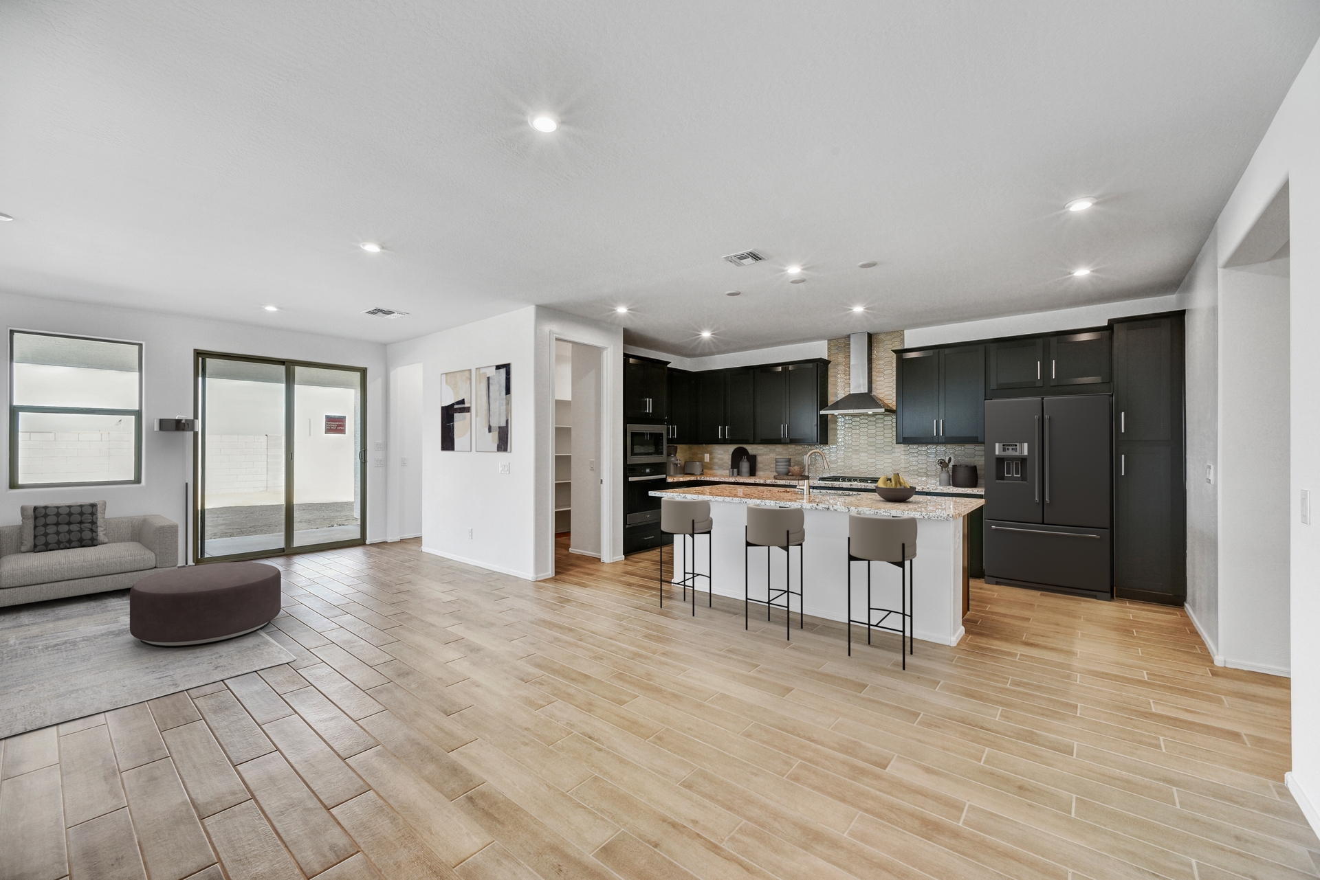 open-concept space with wood-like flooring and plenty of natural light