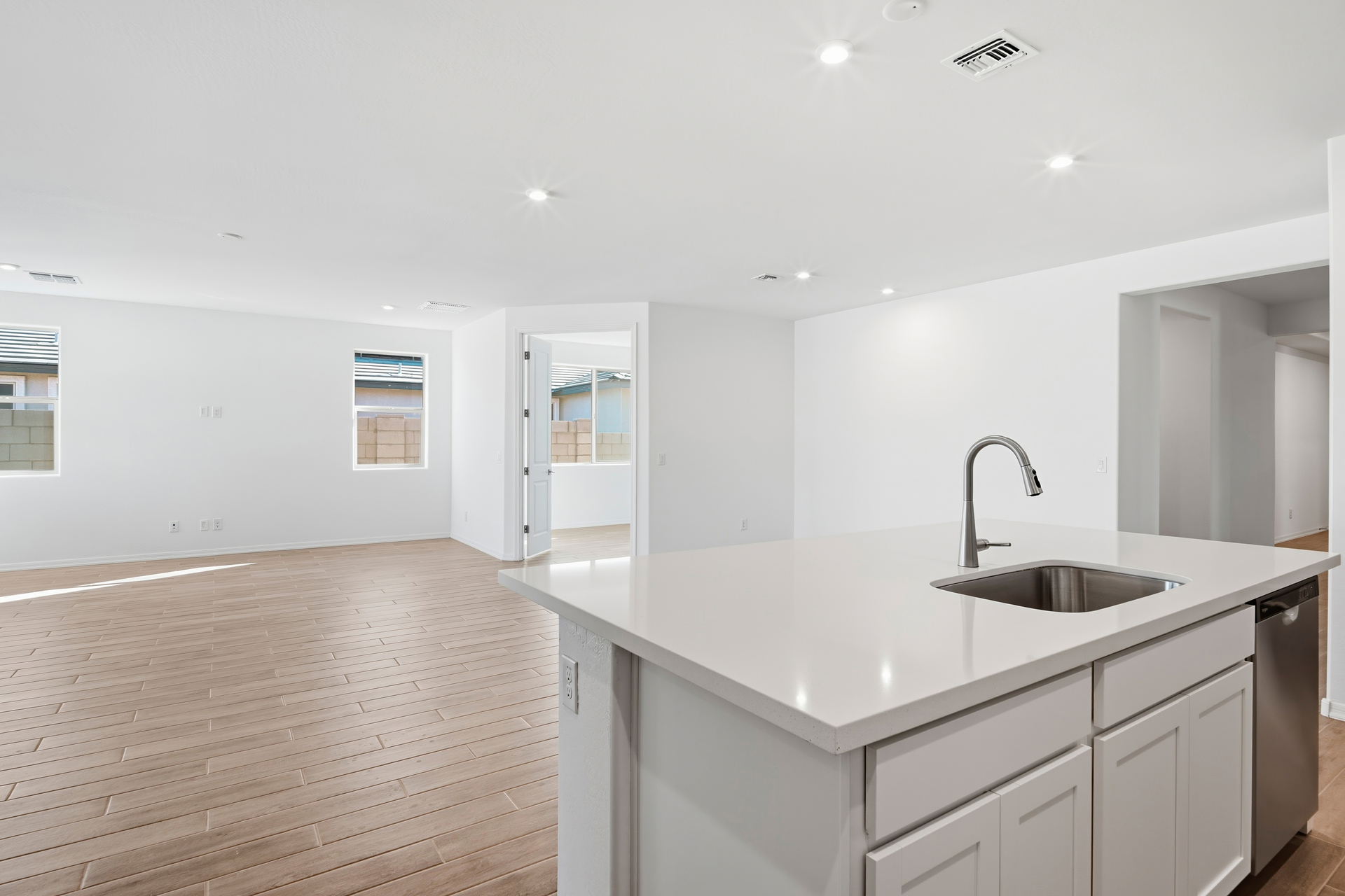 kitchen with white cabinets, quartz countertops, and stainless-steel appliances