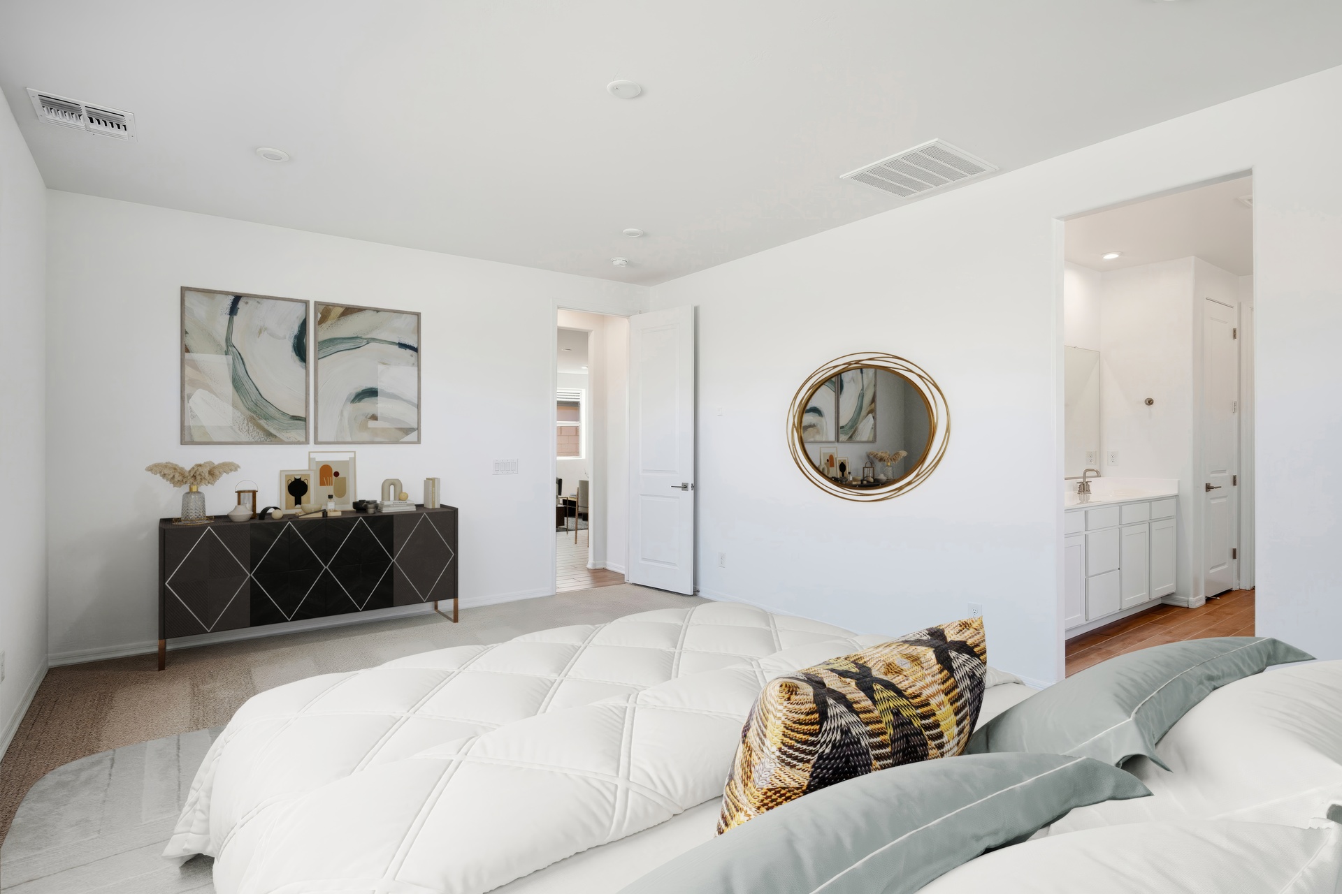 spacious bedroom with a large bed and dark wooden dresser
