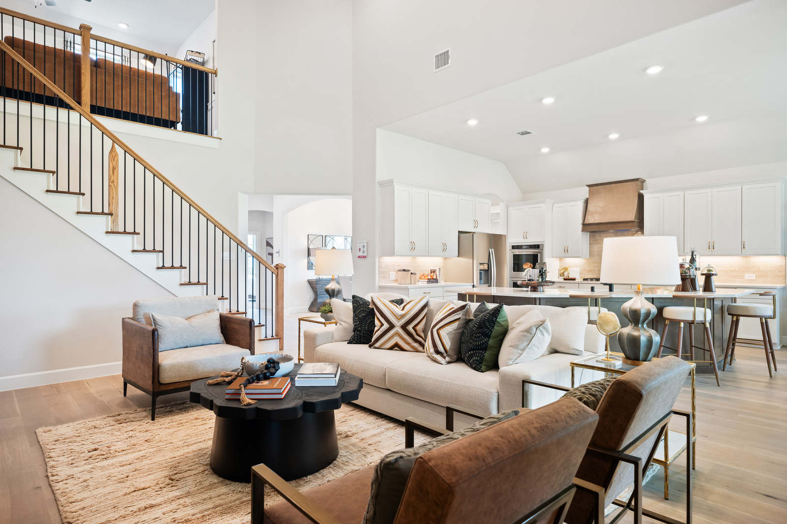 great room with wood floors and tall ceilings