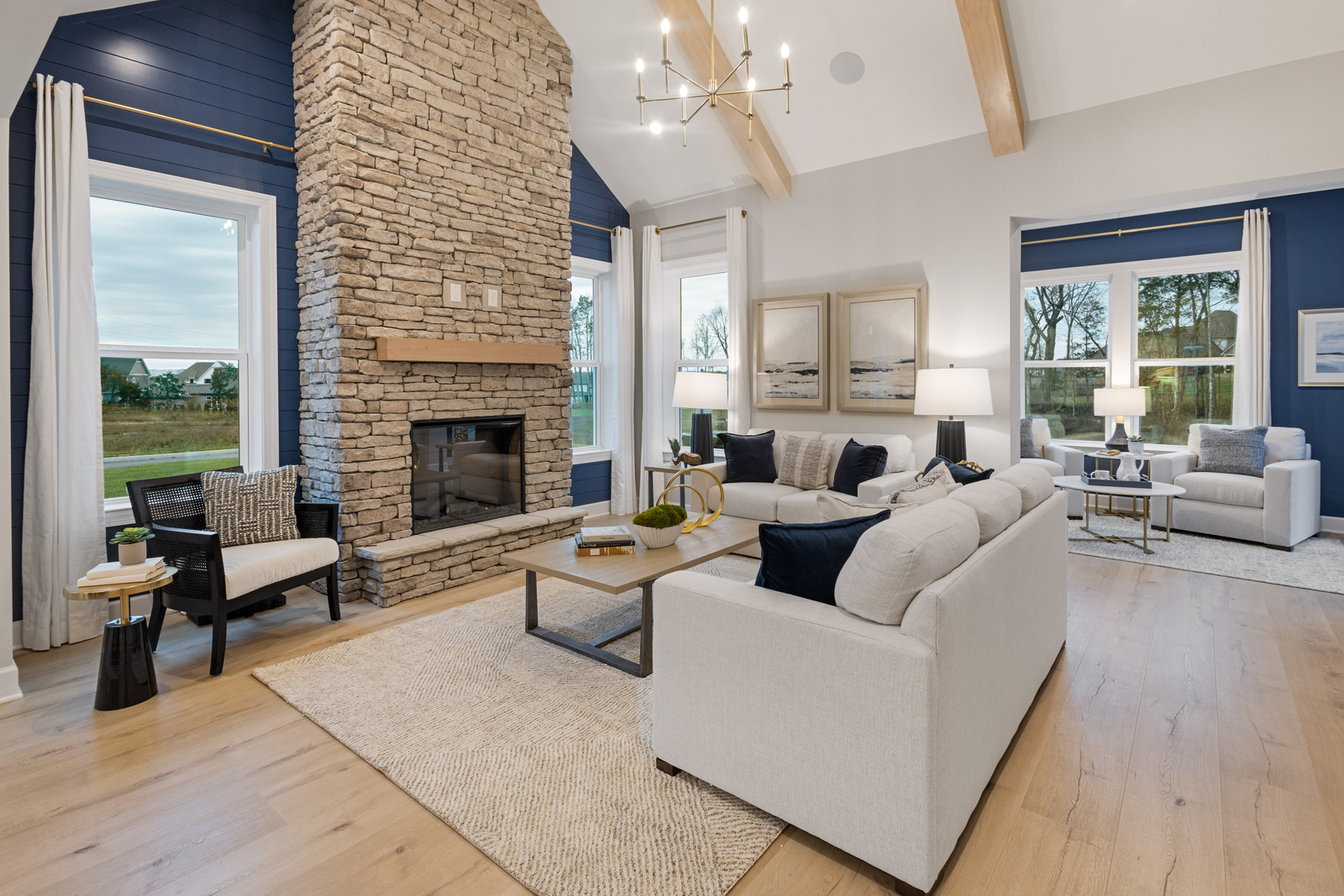 great room with fireplace and vaulted ceiling